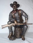John Wayne Bronze Figure Sitting On Log